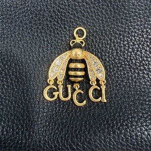 Gucci Black and Gold Colored Bee Zipper Pull